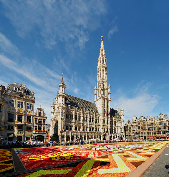 BRUSSELS, BELGIUM-AUGUST 15: African theme Flower Carpet attracted tourists from the entire world to Grand Place on August 15, 2012 in Brussels. This is biennial eve