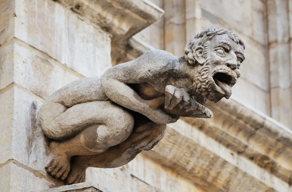 Scary Gargoyle figure decorating medieval Town Hall — Stock Photo, Image