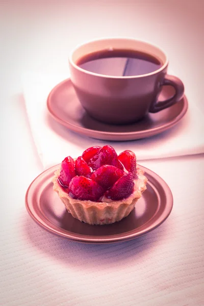 Strawberry dessert in Waffle Basket with Cup of Hot Tea — Stock Photo, Image