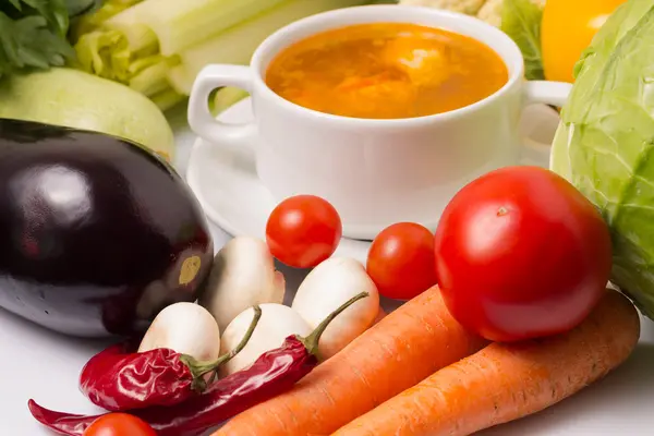 Bowl of Soup with Fresh Vegetables around — Stock Photo, Image