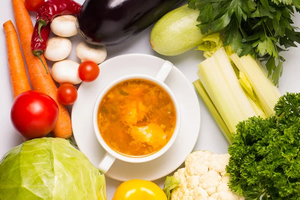 Bowl of Soup with Fresh Vegetables around — Stock Photo, Image