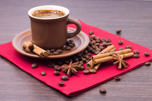 Cup of Coffee with Spices on Red Napkin — Stock Photo, Image