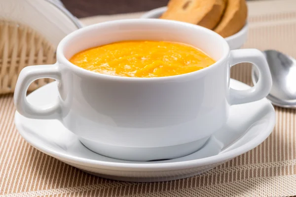 Pumpkin soup in white bowl with crouton — Stock Photo, Image