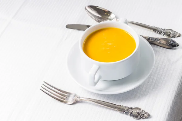 Pumpkin soup on served table — Stock Photo, Image