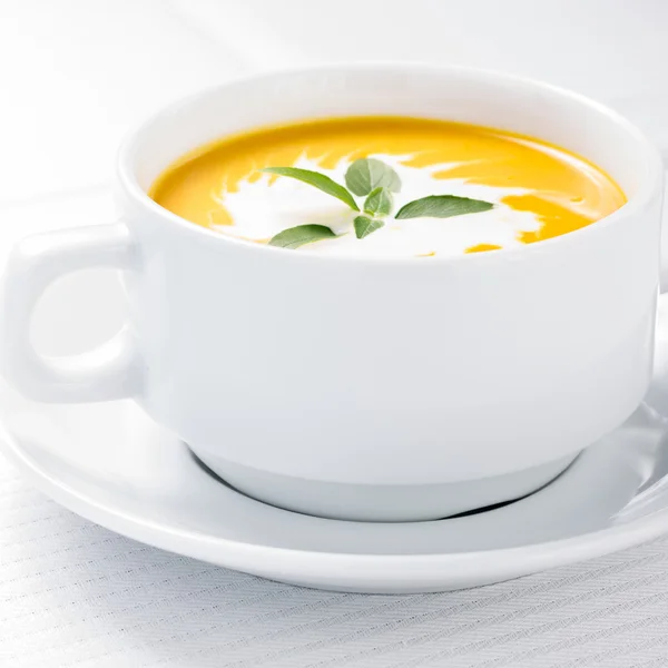 Pumpkin soup on served table — Stock Photo, Image