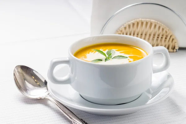 Pumpkin soup on served table — Stock Photo, Image