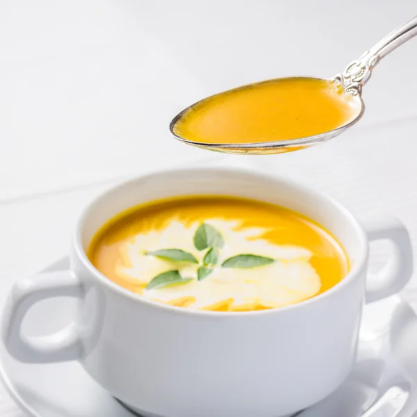 Pumpkin soup on served table — Stock Photo, Image