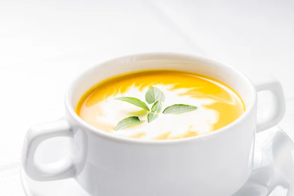 Pumpkin soup on served table — Stock Photo, Image