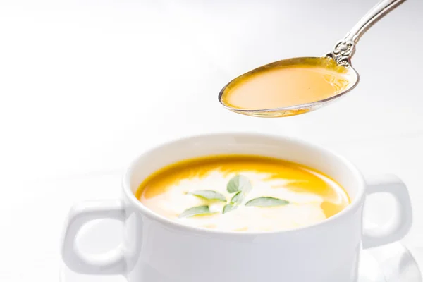 Pumpkin soup on served table — Stock Photo, Image