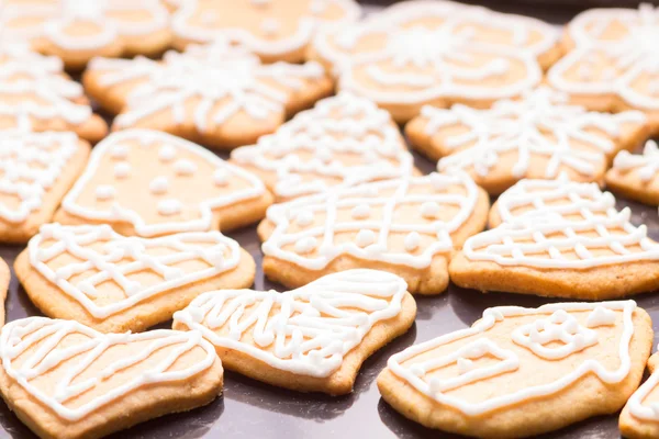 Gingerbread iced cookies on table — Stock Photo, Image