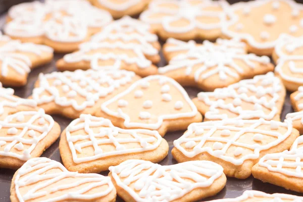 Gingerbread iced cookies on table — Stock Photo, Image