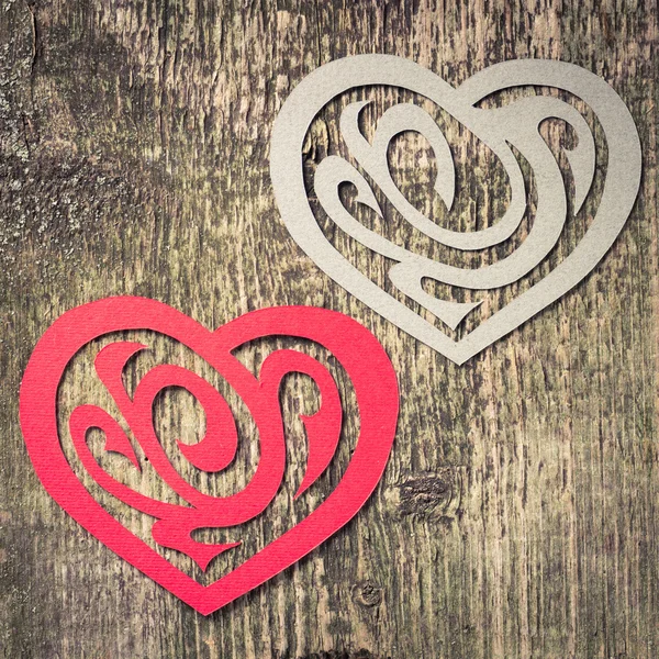 Two Paper Heart Ornamental Shape on wood — Stock Photo, Image