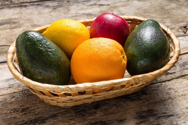 Various Fruits in Wicker on Greunge Wood Background — Stock Photo, Image