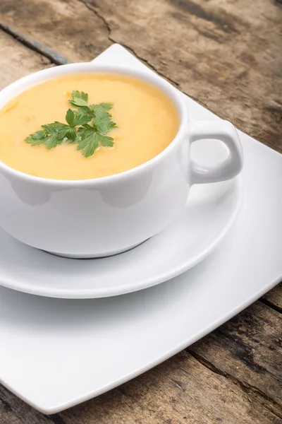 Pea soup on wood weathered background — Stock Photo, Image