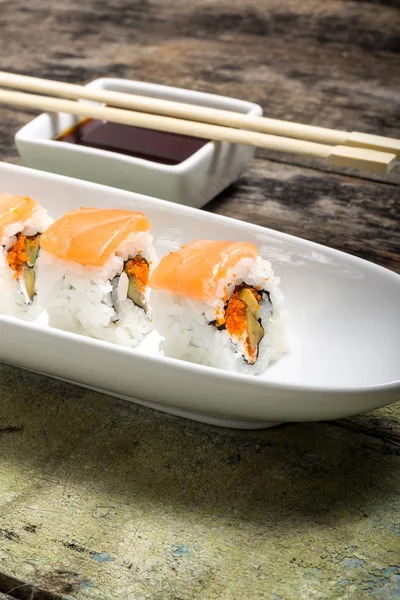 Seafood Sushi rolls in White Long Dish with soy sauce — Stock Photo, Image