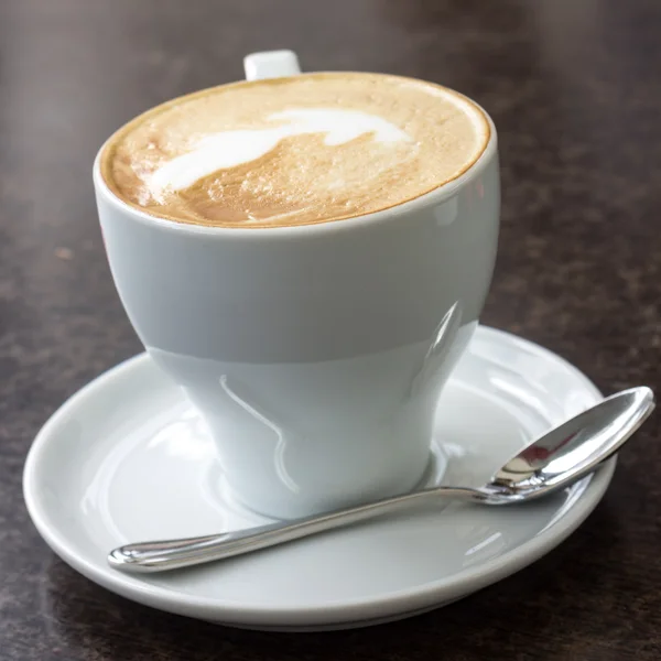 Cup of Cappuccino served in cafe — Stock Photo, Image