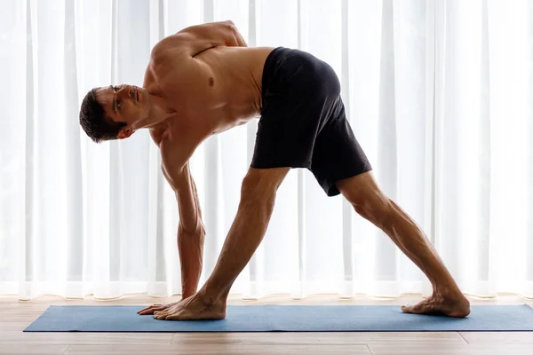 Young Man Doing Triangle Yoga Pose Morning Window — Stock Photo, Image