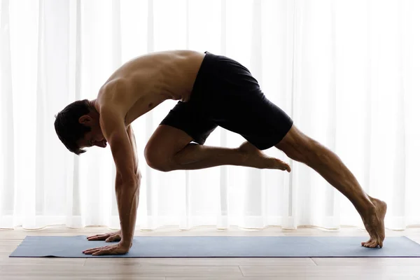 Young Fit Man Doing Yoga Practice Studio Morning — Zdjęcie stockowe