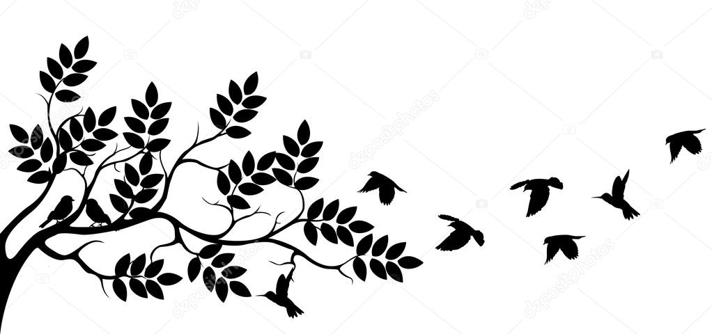 Tree silhouette with bird flying