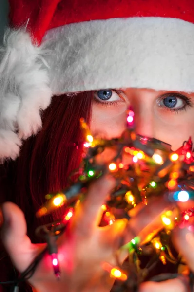 Woman with christmas garland lights — Stock Photo, Image