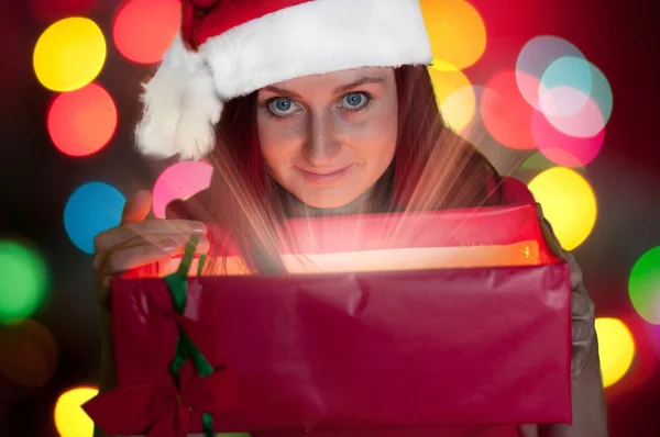 Happy young woman opening gift box — Stock Photo, Image