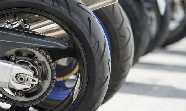 motorcycle wheel in a row