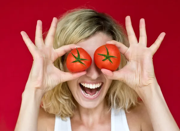 Girl with tomatoes — Stock Photo, Image