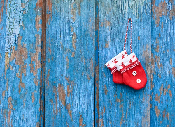 Red gloves on woody bacground — Stock Photo, Image