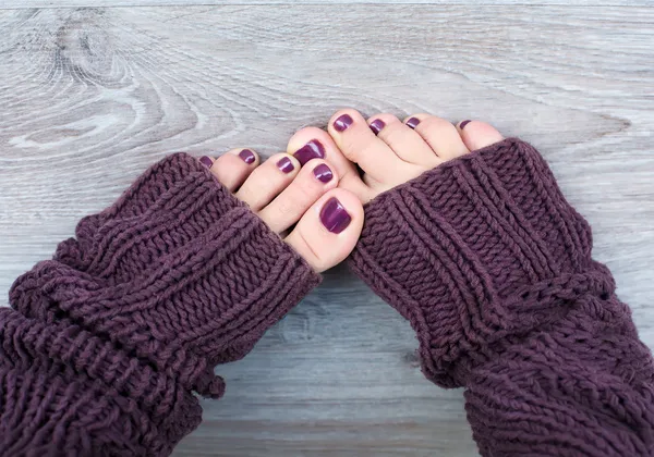 Female feet in brown socks — Stock Photo, Image