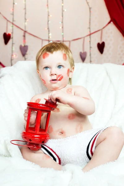 Kid covered in kisses — Stock Photo, Image