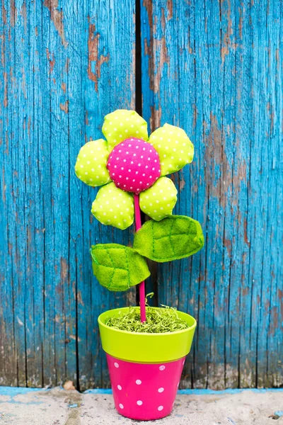 Toy flower on wooden background — Stock Photo, Image