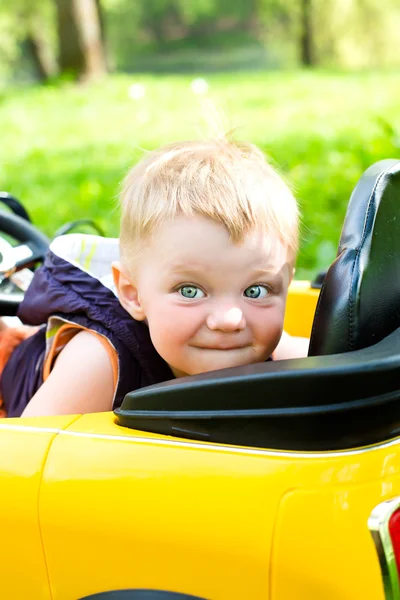 Boy won his yellow car — Stock Photo, Image