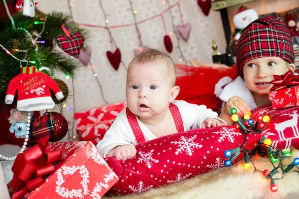 TWo kids in santa's hat Stock Picture