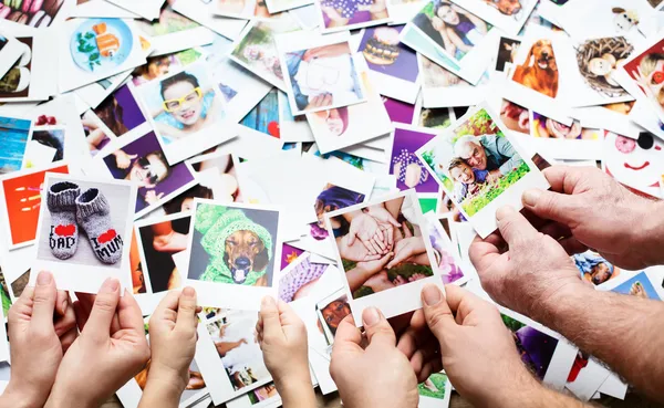 Set of images in family hands — Stock Photo, Image