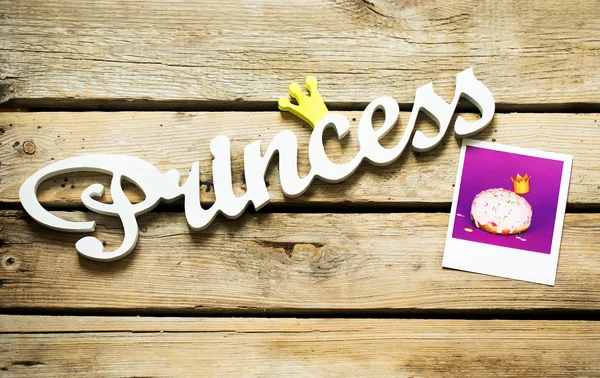 Princess sign next to the photo — Stock Photo, Image