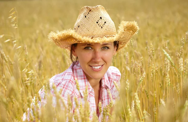 Summer shoot of attractive girl in straw hat Stock Picture