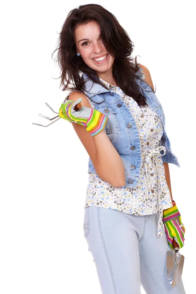 Young smiling gardening girl with gloves in blue jeans, isolated — Stock Photo, Image