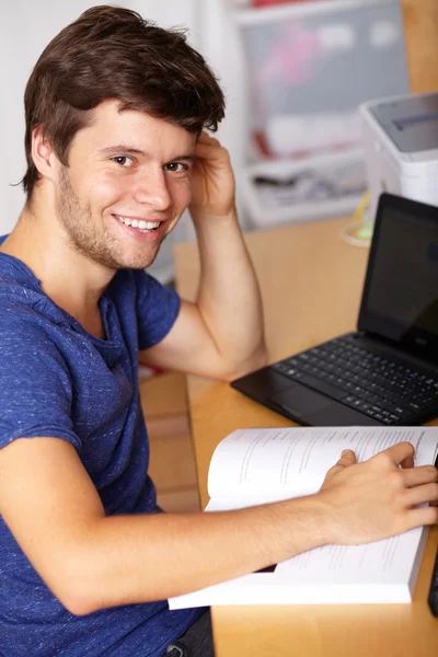 Young handsome guy with laptop in room, background — Stock Photo, Image