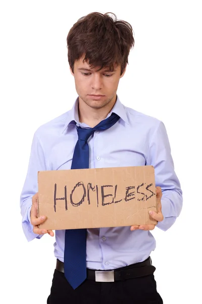 Depressed young businessman holding a cardboard, isolated on whi — Stock Photo, Image