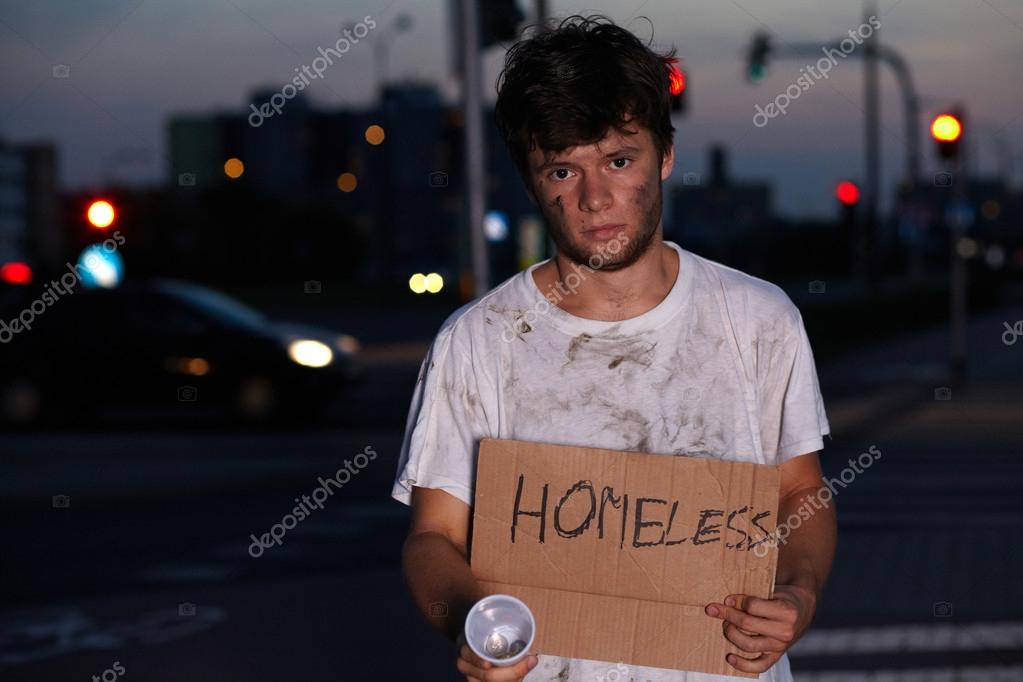 Homeless guy asking for help, sitting on a street Stock Photo by ©miszaqq 14248797