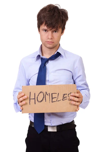 Depressed young businessman holding a cardboard, isolated on whi — Stock Photo, Image