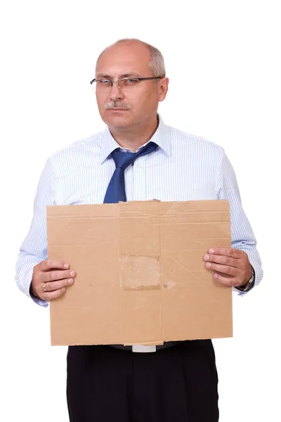 Depressed senior businessman holding a cardboard, isolated on wh — Stock Photo, Image