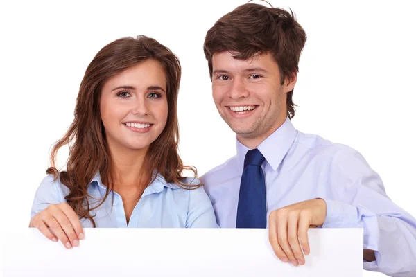 Businesswoman with businessman holding white board, isolated on — Stock Photo, Image