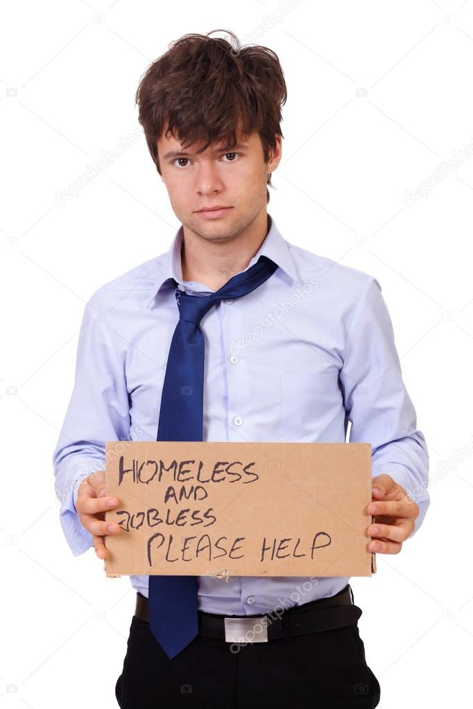 Depressed young businessman holding a cardboard, isolated on whi