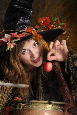 halloween witch with poisoned apple clipart