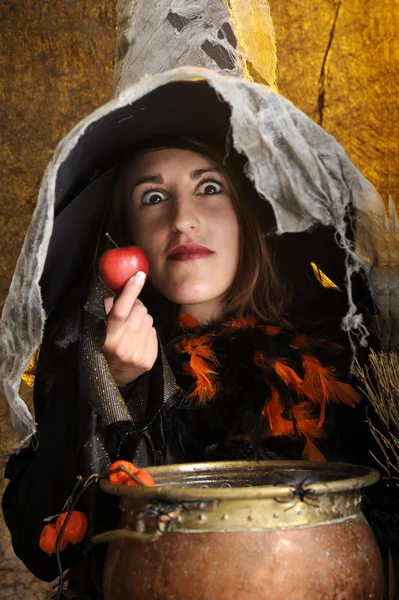 Witch giving a poisened apple — Stock Photo, Image