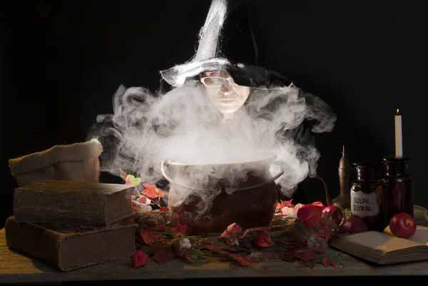 Halloween witch with cauldron — Stock Photo, Image
