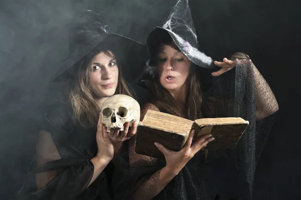 Two witches pronouncing magic formulas — Stock Photo, Image