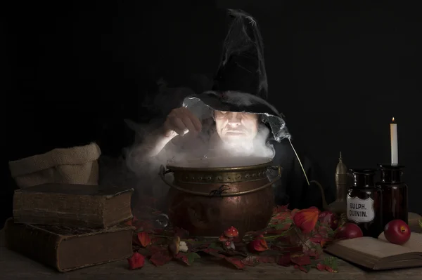 Halloween witch with cauldron — Stock Photo, Image