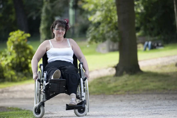 Adult woman in wheelchair , outdoors — Stock Photo, Image